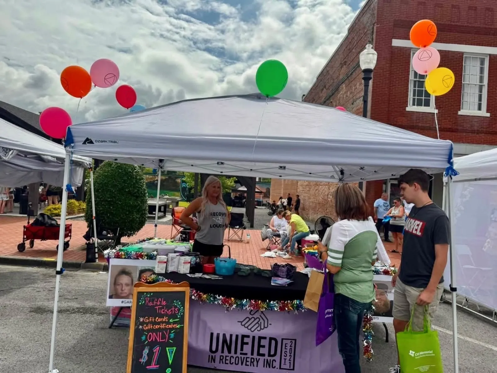 Unified in Recovery community members at a community event